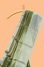 Green checked zari motifs design art tissue saree with self zari border and contrast motifs blouse