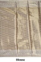 Green checked zari motifs design art tissue saree with self zari border and contrast motifs blouse