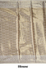 Green checked zari motifs design art tissue saree with self zari border and contrast motifs blouse
