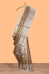 Golden beige checked zari motifs design art tissue saree with contrast zari border and matching printed blouse