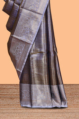 Lavender checked zari motifs design art tissue saree with contrast zari border and matching printed blouse