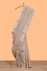 Beige chevron design art tissue saree with self zari border and matching printed blouse