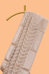 Beige chevron design art tissue saree with self zari border and matching printed blouse