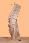 Beige geometric zari design art tissue saree with self zari border and matching blouse