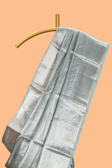 Pastel green vertical striped design art tissue saree with self zari border and matching blouse