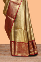 Mustard yellow geometric design art tissue saree with contrast zari border and blouse