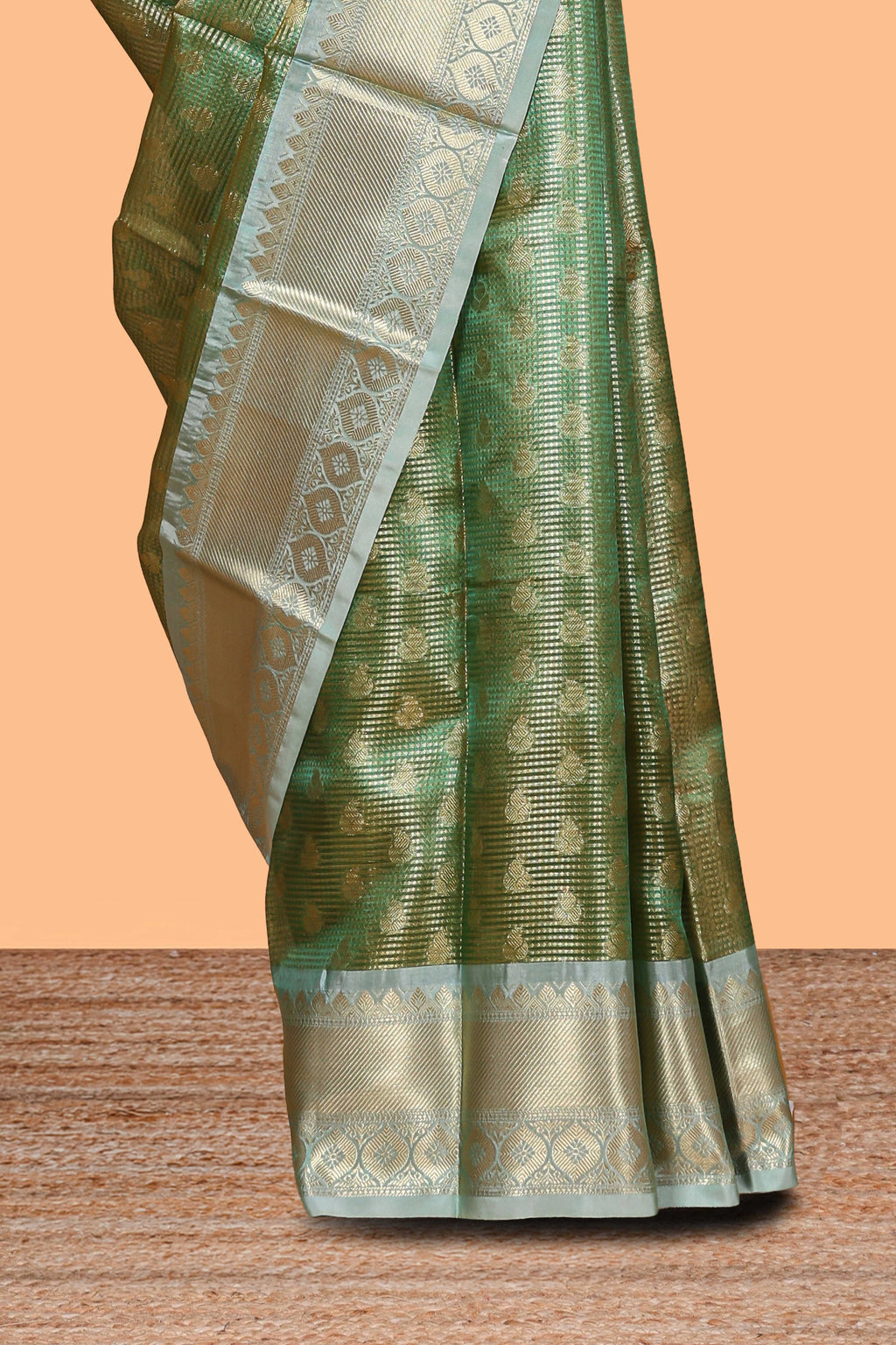 Green unique design zari motifs art tissue saree with contrast border and blouse