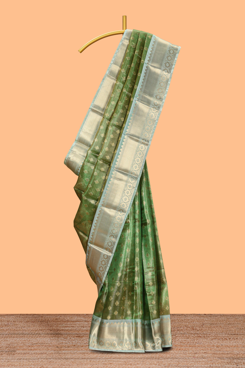 Green unique design zari motifs art tissue saree with contrast border and blouse