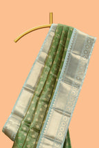 Green unique design zari motifs art tissue saree with contrast border and blouse