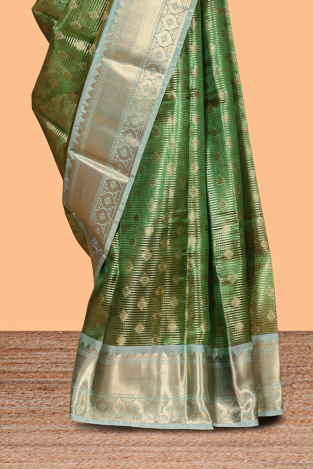 Green unique design zari motifs art tissue saree with contrast border and blouse