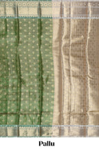 Green unique design zari motifs art tissue saree with contrast border and blouse