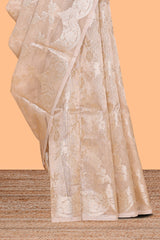 Beige floral zari design art tissue saree with self pallu and matching blouse