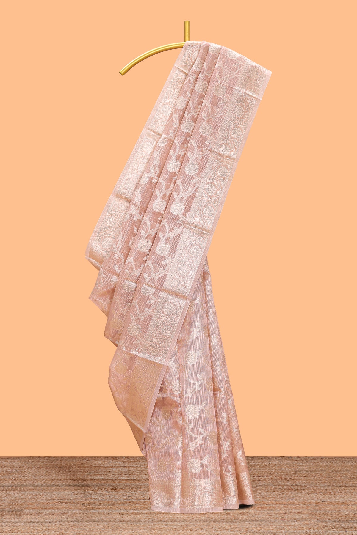 Warm peach floral vine design art tissue saree with zari work border and blouse