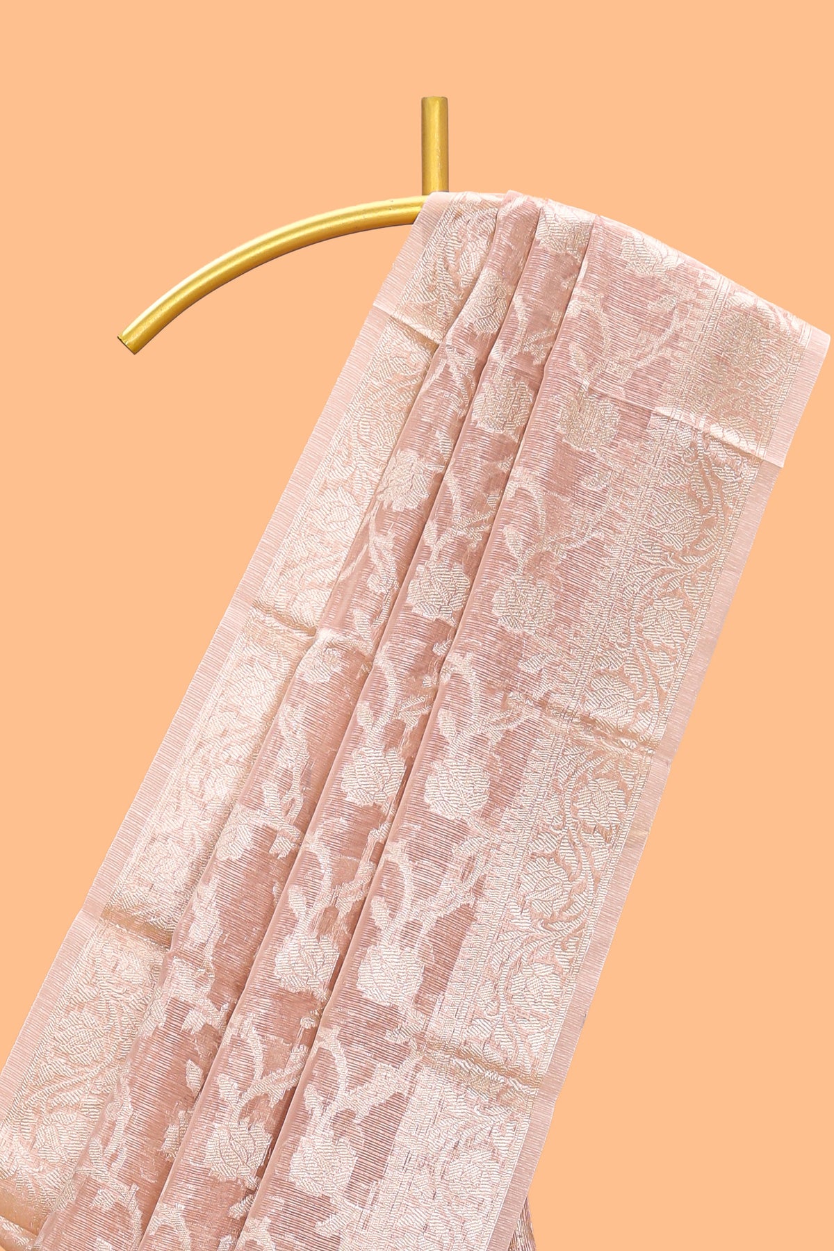 Warm peach floral vine design art tissue saree with zari work border and blouse