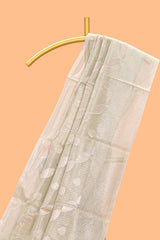 Mint green scattered floral and leaf motifs art tissue saree with self pallu and plain border