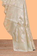 Mint green scattered floral and leaf motifs art tissue saree with self pallu and plain border