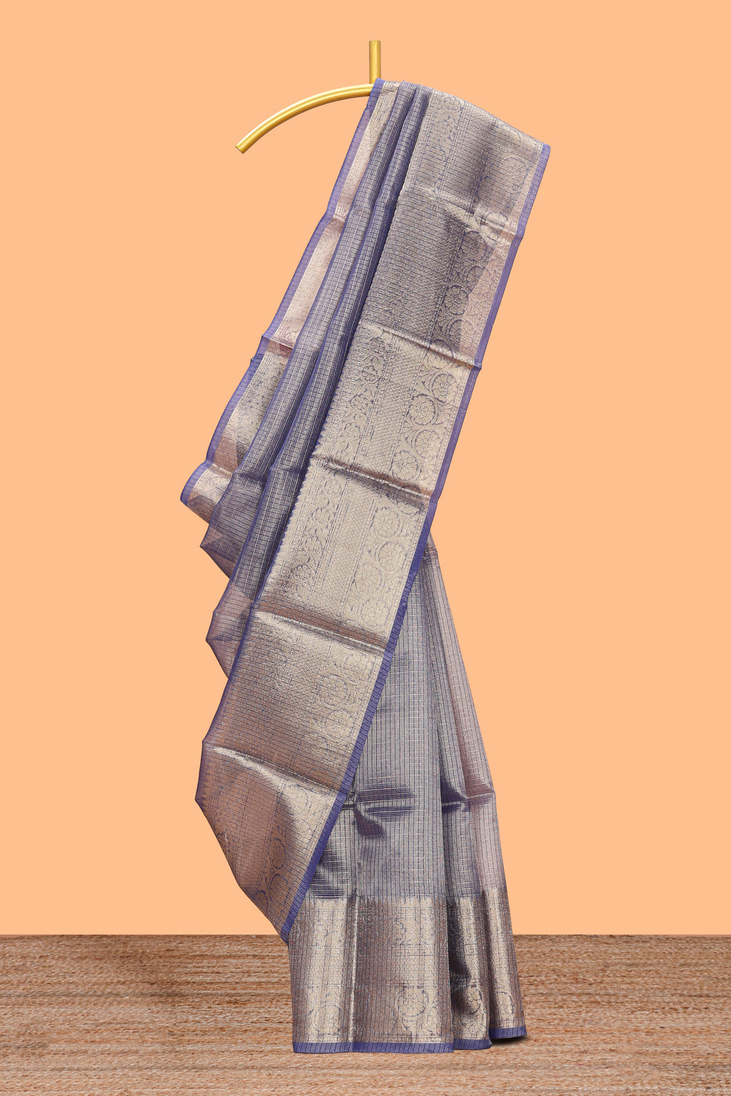 Ink blue color checked art tissue saree with contrast zari border and blouse