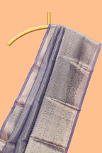 Ink blue color checked art tissue saree with contrast zari border and blouse
