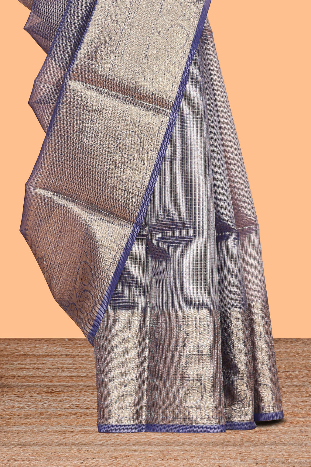 Ink blue color checked art tissue saree with contrast zari border and blouse