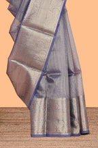 Ink blue color checked art tissue saree with contrast zari border and blouse
