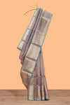 Mauve shade art tissue saree with antique gold zari border and contrast blouse