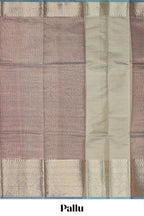 Mauve shade art tissue saree with antique gold zari border and contrast blouse