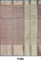 Mauve shade art tissue saree with antique gold zari border and contrast blouse