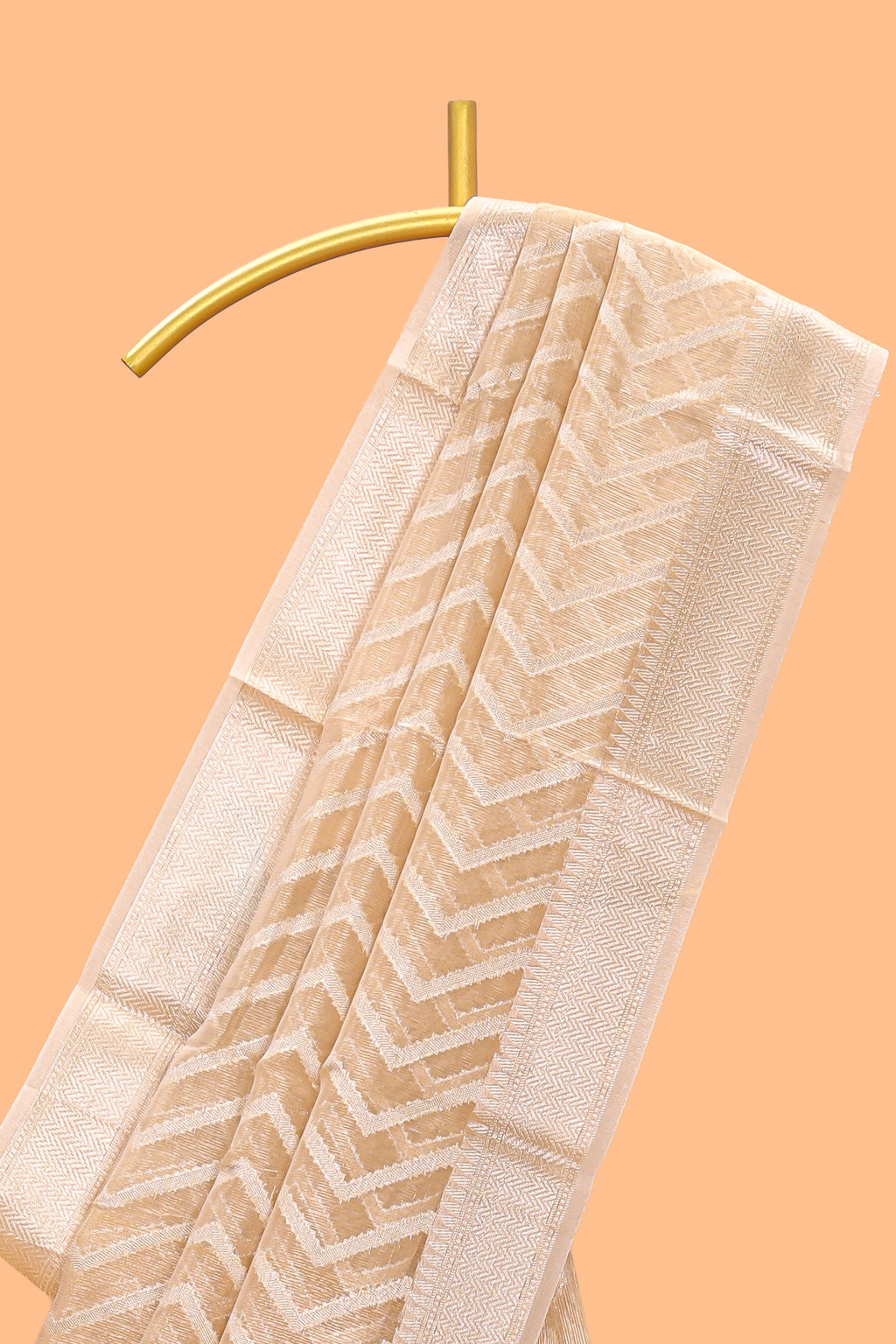 Pale peach geometric design art tissue saree with zari border and plain blouse