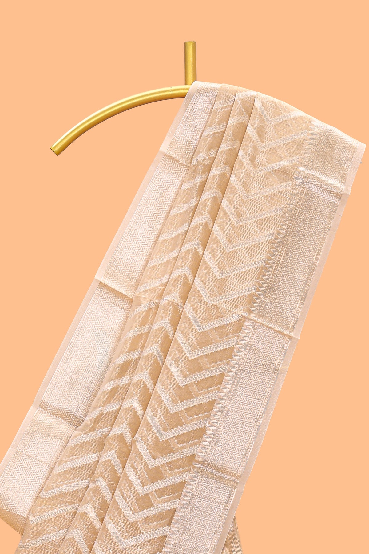 Pale peach geometric design art tissue saree with zari border and plain blouse