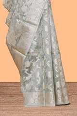 Silver sage green floral design art tissue saree with silver zari border and blouse