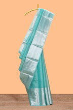 Peacock green shade plain art tissue saree with silver zari border and matching blouse