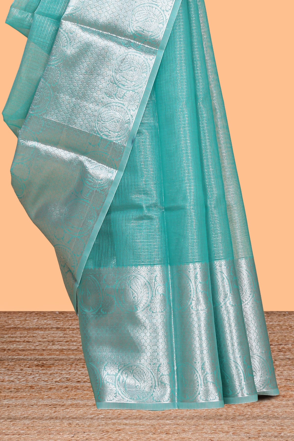 Peacock green shade plain art tissue saree with silver zari border and matching blouse