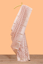 Peach color geometric design art tissue saree with contrast zari border and matching blouse