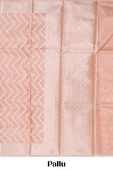 Peach color geometric design art tissue saree with contrast zari border and matching blouse