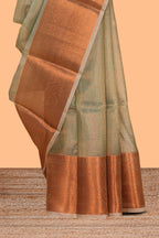 Muted green checked art tissue saree with contrast rust orange border and blouse
