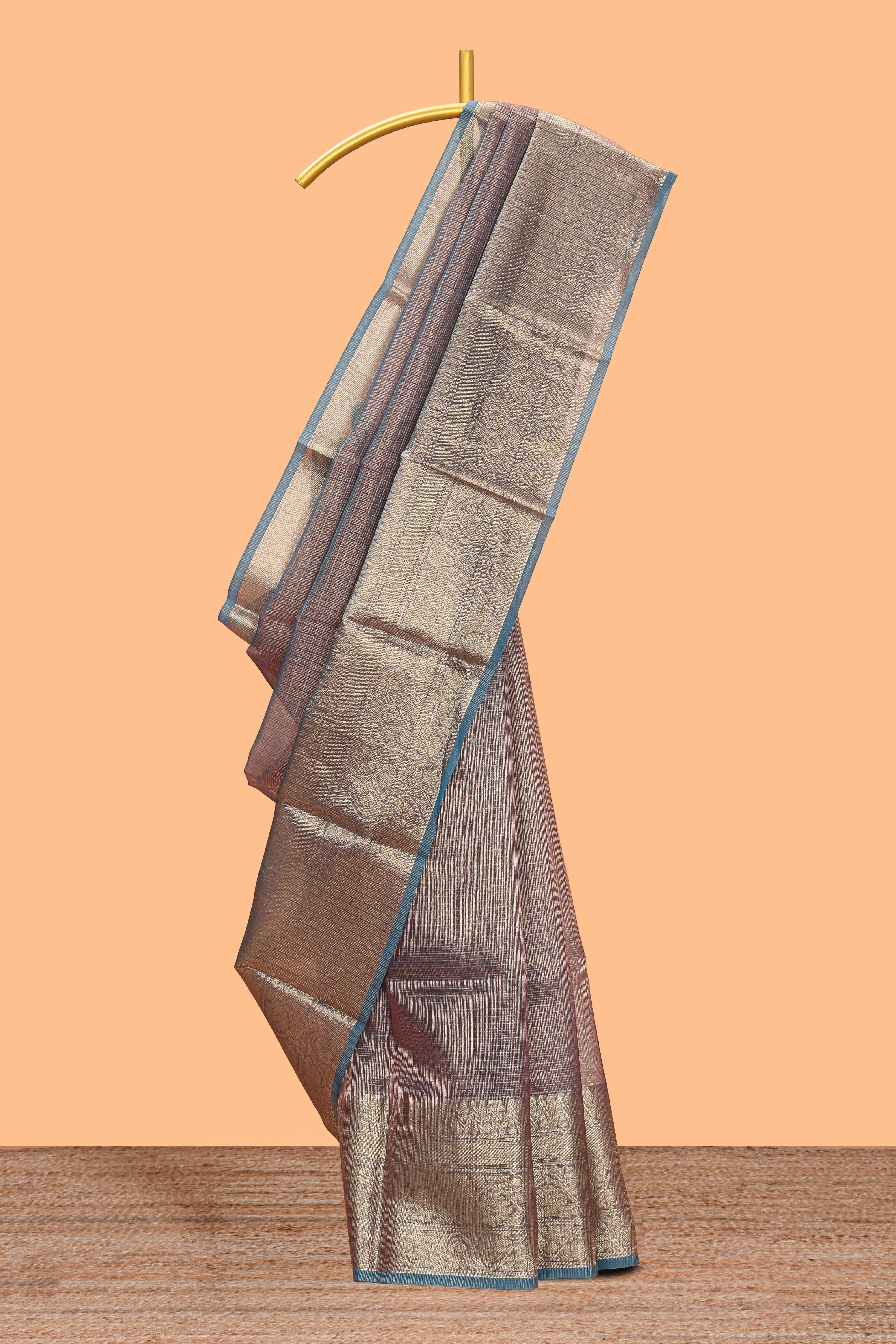 Blue shade checked art tissue saree with contrast zari border and blouse