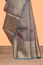 Blue shade checked art tissue saree with contrast zari border and blouse