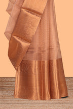 Coppor rust plain art tissue saree with coppor zari border and matching blouse