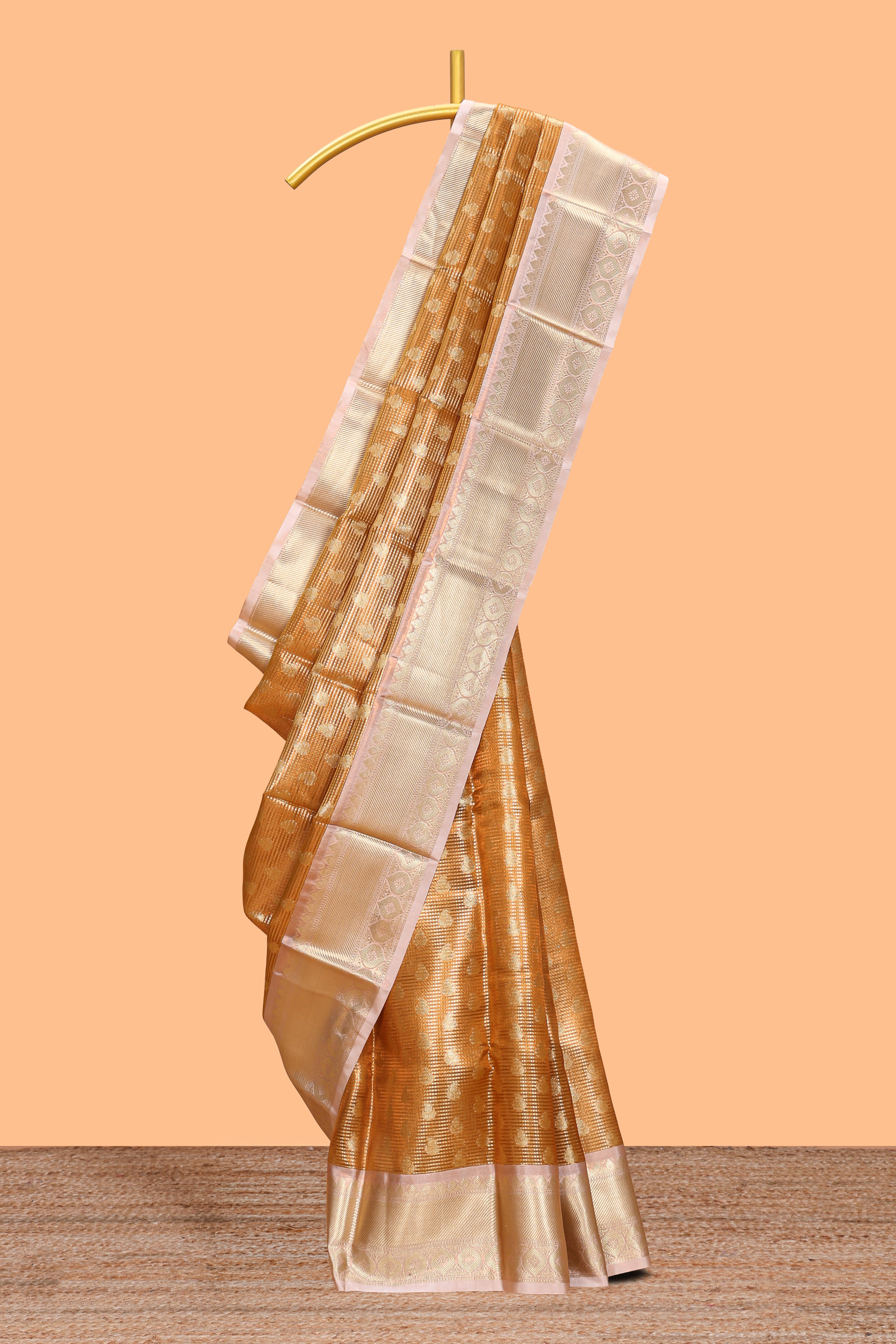 Rust orange zari butta design art tissue saree with contrast zari border and blouse