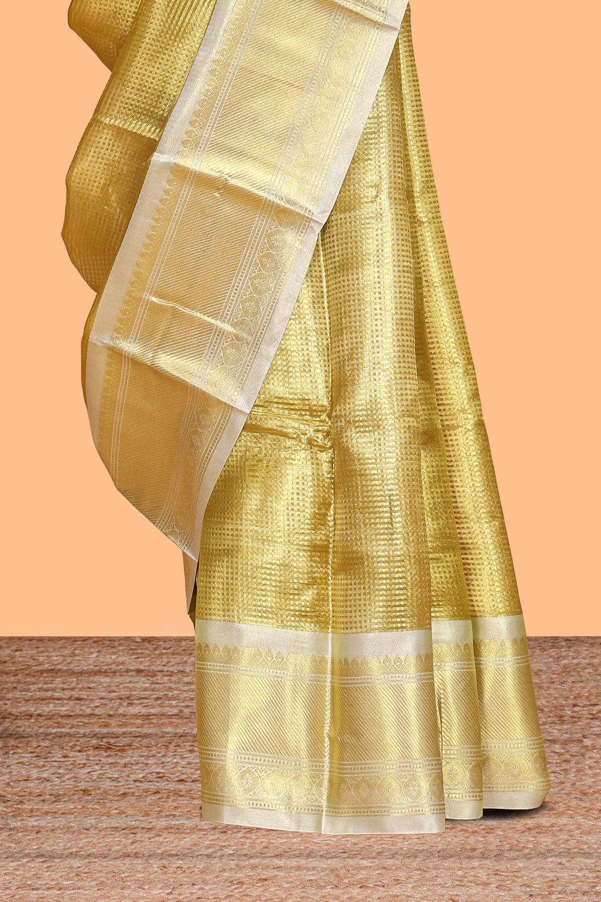 Bright gold zari design art tissue saree with contrast zari border and blouse