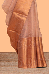 Coppor peach plain art tissue saree with contrast zari border and matching blouse