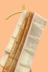 Bronze striped art tissue saree with contrast zari border and blouse
