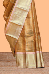 Bronze striped art tissue saree with contrast zari border and blouse
