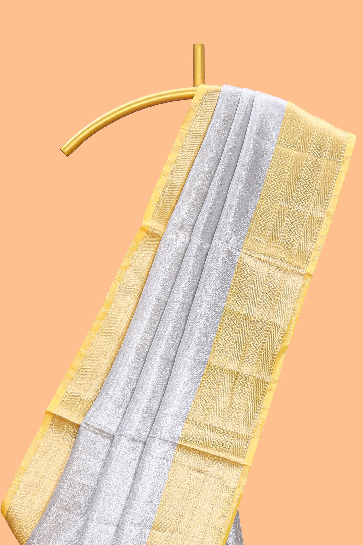 Silver zari motifs art tissue saree with gold contrast border and blouse