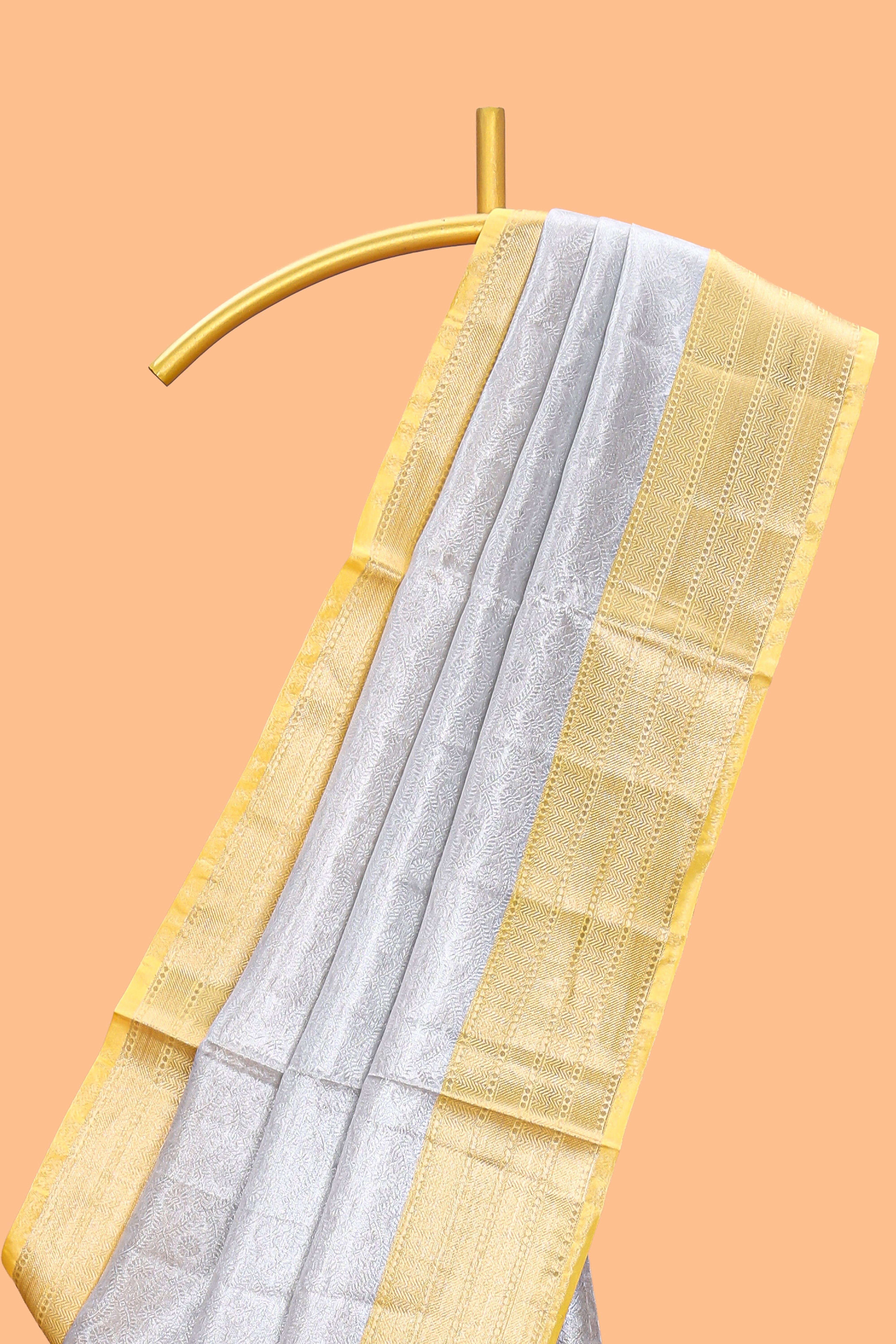Silver zari motifs art tissue saree with gold contrast border and blouse