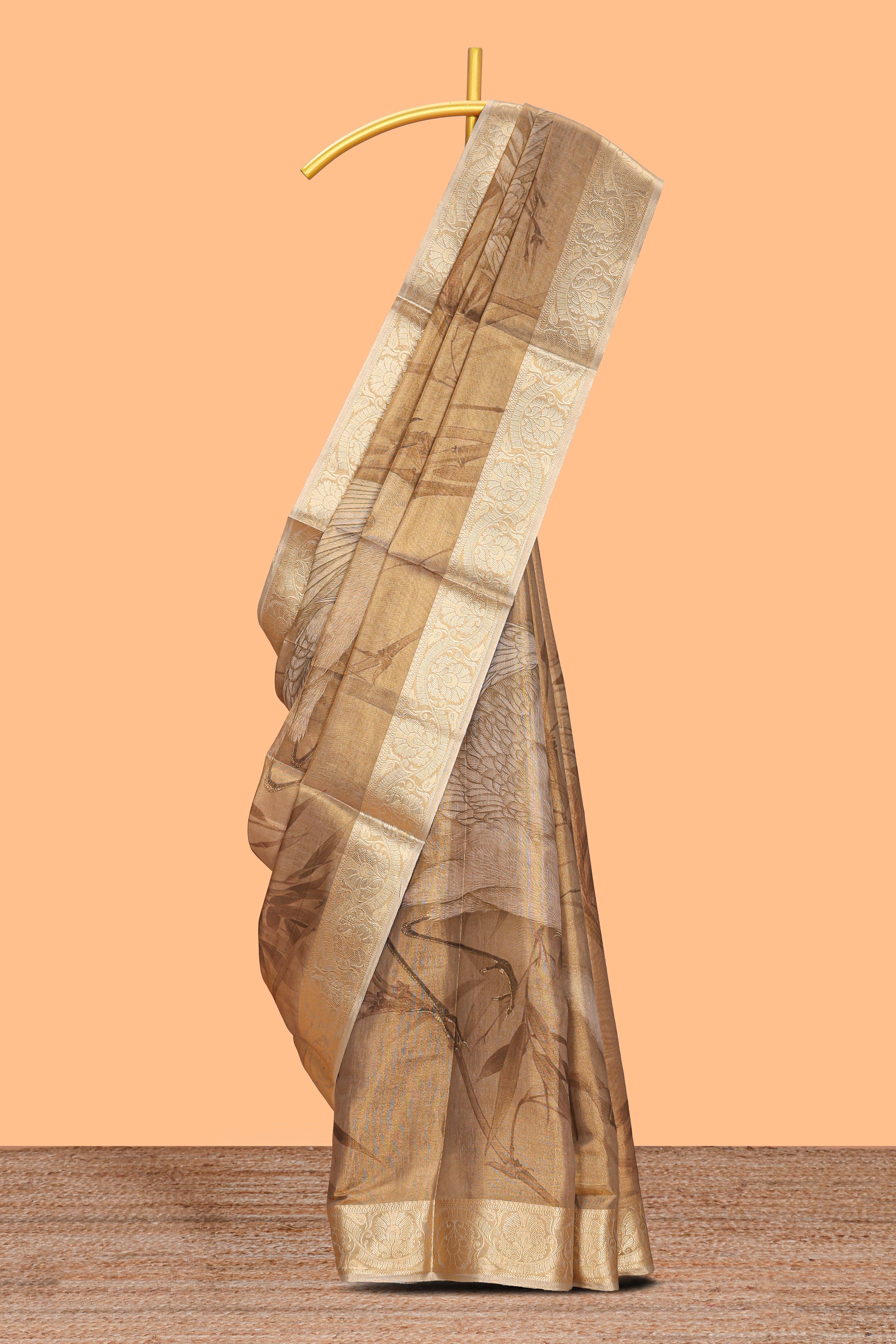 Brown floral & bird design art tissue saree with self zari border and matching blouse