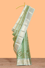 Green zari motifs design art tissue saree with contrast zari border and motifs blouse