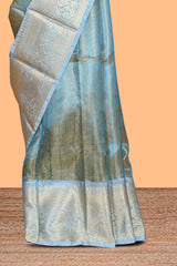 Blue zari design art tissue saree with self zari border and contrast blouse