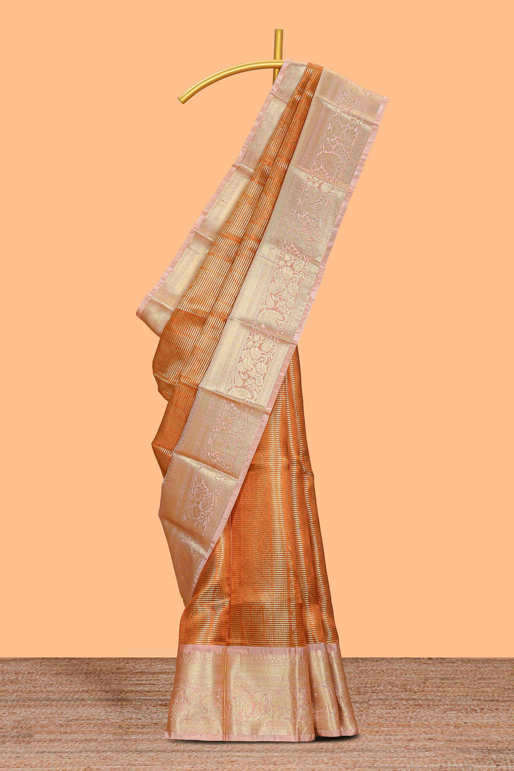Orange zari design art tissue saree with contrast zari border and contrast blouse