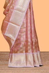 Rust orange zari design art tissue saree with contrast zari border and motifs blouse